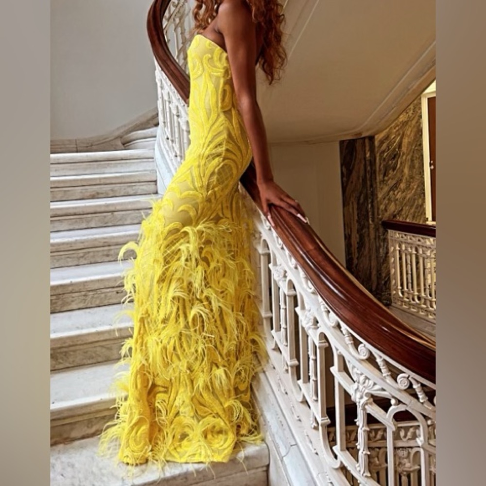 Yellow prom dress with feathers